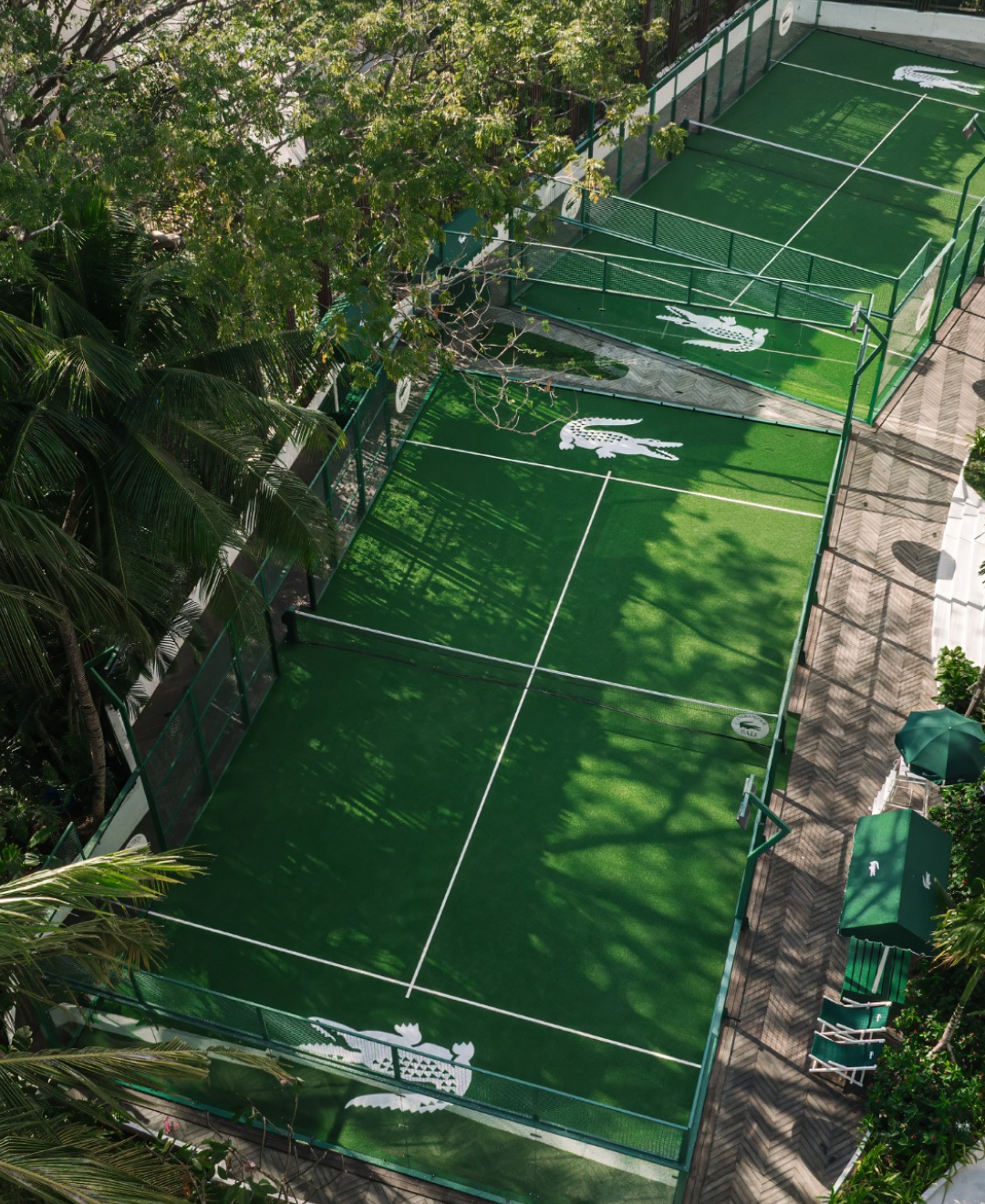The completed Lacoste padel courts surrounded by tropical trees at W Bali – Seminyak