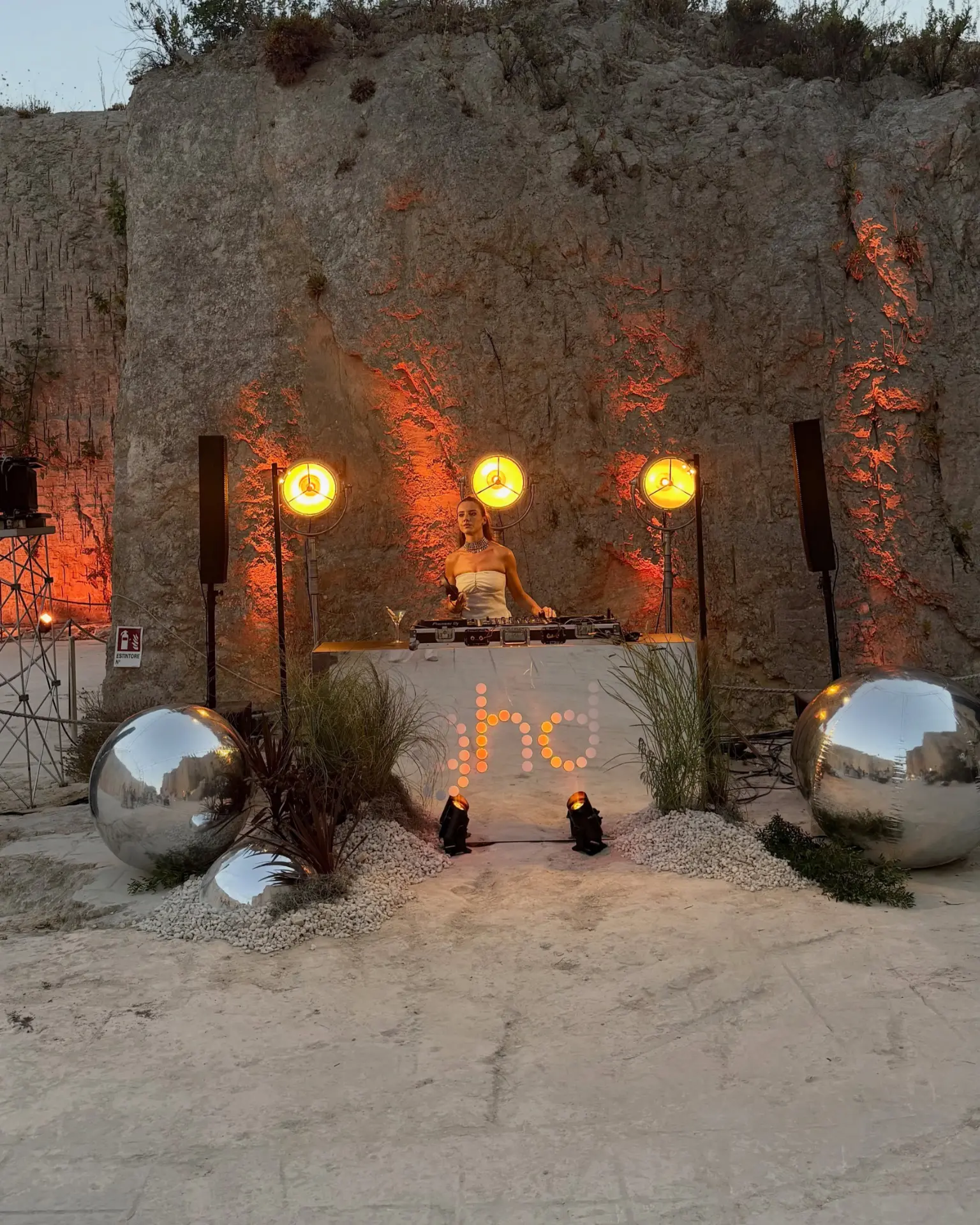 The ghd DJ booth lit at dusk at the final event