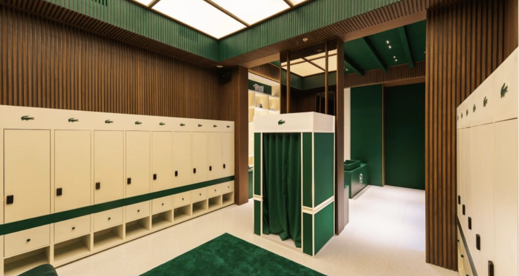 The finished changing room with cream lockers, green trim and dark wood